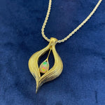 Front view Divine Goddess Pendant by Angel Aberdeen in brass with 14K gold Mandorla Shaped PVD finish and lab-grown opal center stone, symbolizing sacred feminine energy within the mandorla form.