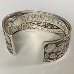 Hand-engraved sterling silver cuff reading “SURVIVOR – My Life is Precious.” A one-of-a-kind bracelet celebrating strength, healing, and rebirth.