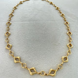 Elegant 14K gold-plated mandorla chain symbolizing divine feminine unity.
Handcrafted, engraved “Made on Earth.” A sacred geometry necklace.