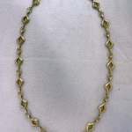 Elegant 14K gold-plated mandorla chain symbolizing divine feminine unity.
Handcrafted, engraved “Made on Earth.” A sacred geometry necklace.