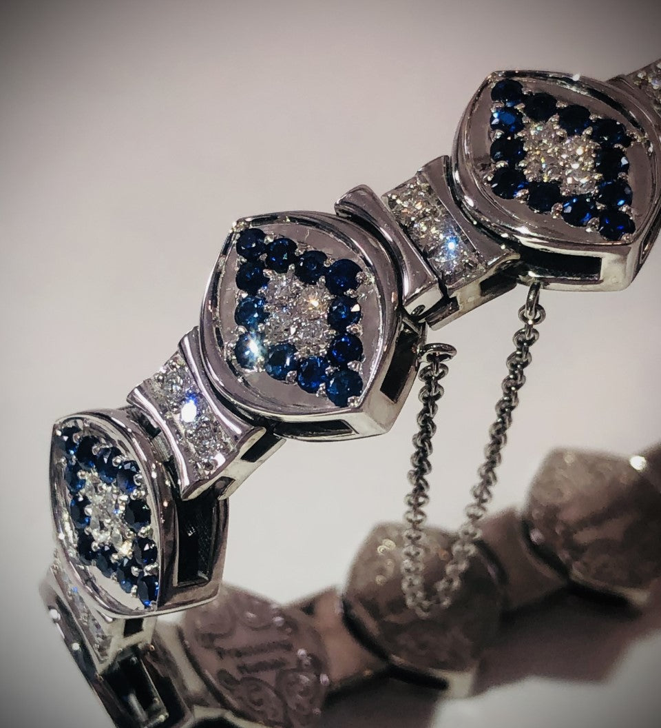 Elegant 14KT white gold bracelet with sapphires and diamonds from the Angel Aberdeen Sacred Mandorla Collection, photographed under soft light.